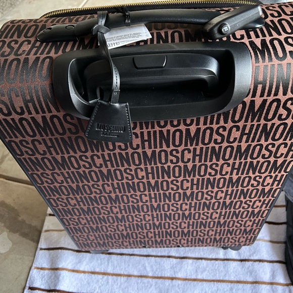 Moschino 18 Inch Logo Spinner Swuitcases each sold separately 500each or 900both - Picture 6 of 10